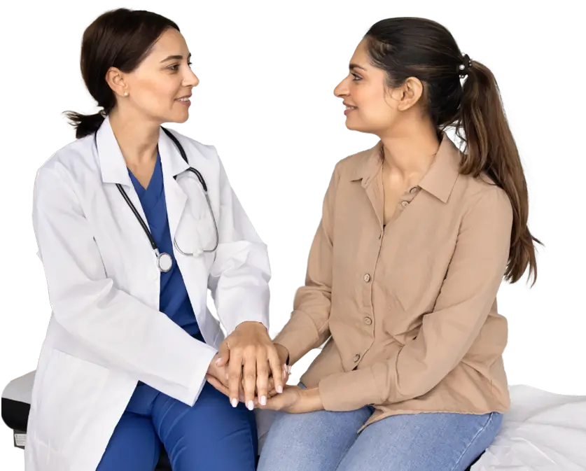A woman discusses her health concerns with a doctor in a clinical setting.