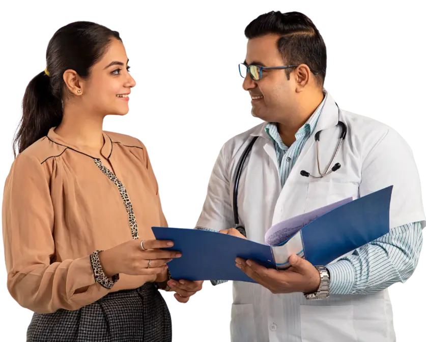 A doctor speaks with a woman, discussing health matters in a clinical environment.